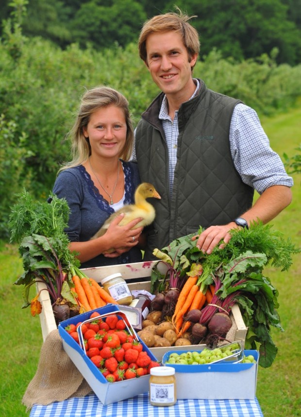 White House Farm pick your own, Oliver Gurney and his wife Lottie and their ' family ' of young goslings. Photo: Steve Adams